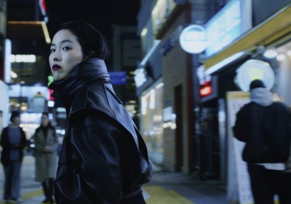 A woman standing on a city street