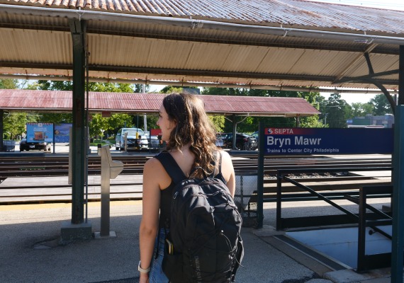 student waits for a train