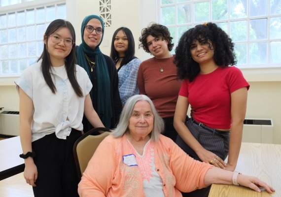 Fiona Shen '27, Nada Elshafey '26, Anna Nguyen '25, Emma Dermansky '27, and Isbah Ameer '26 stand for a photo with Ann Doley, seated.