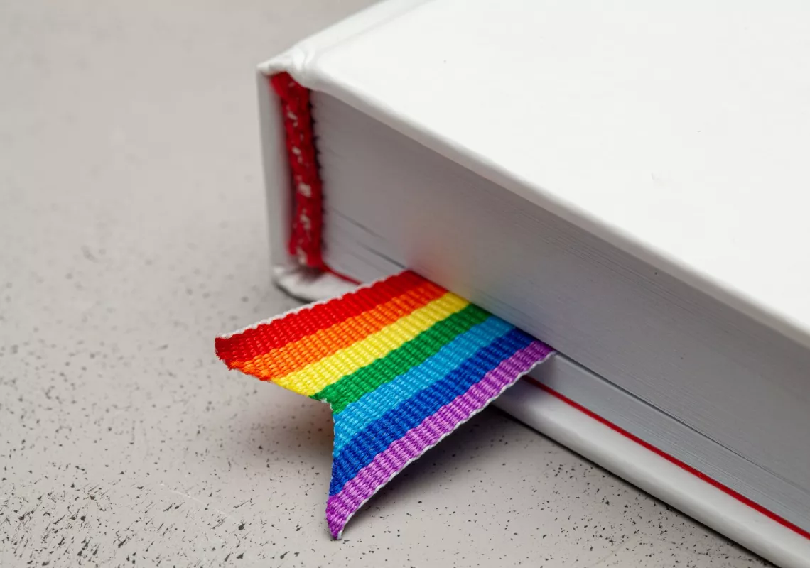 Book with rainbow ribbon