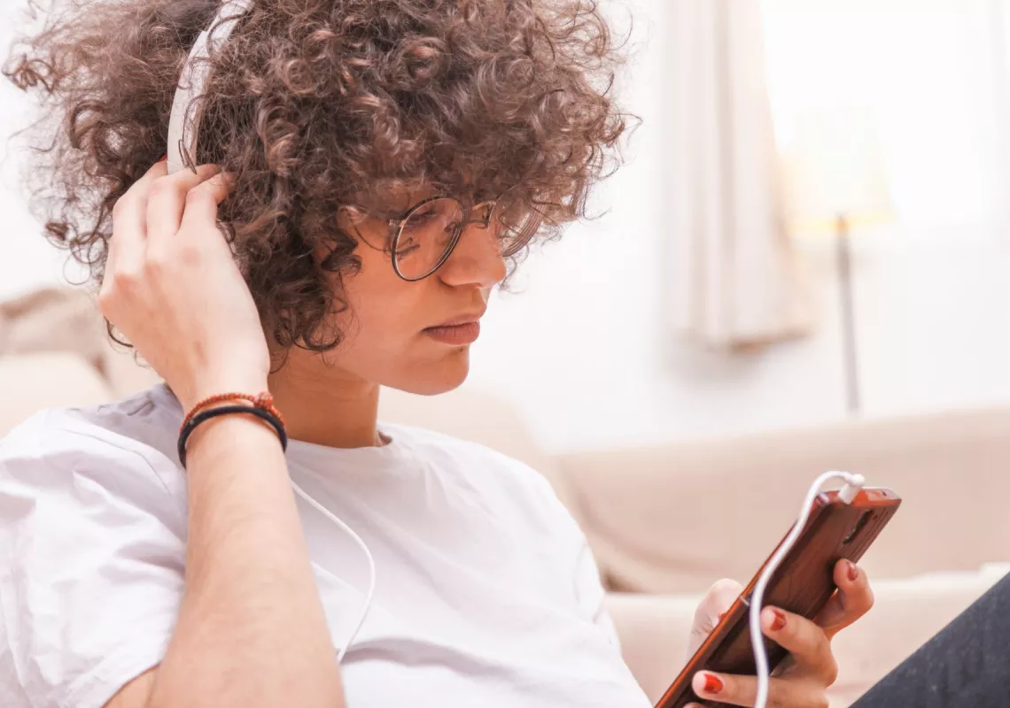 stock-student-listening-headphones