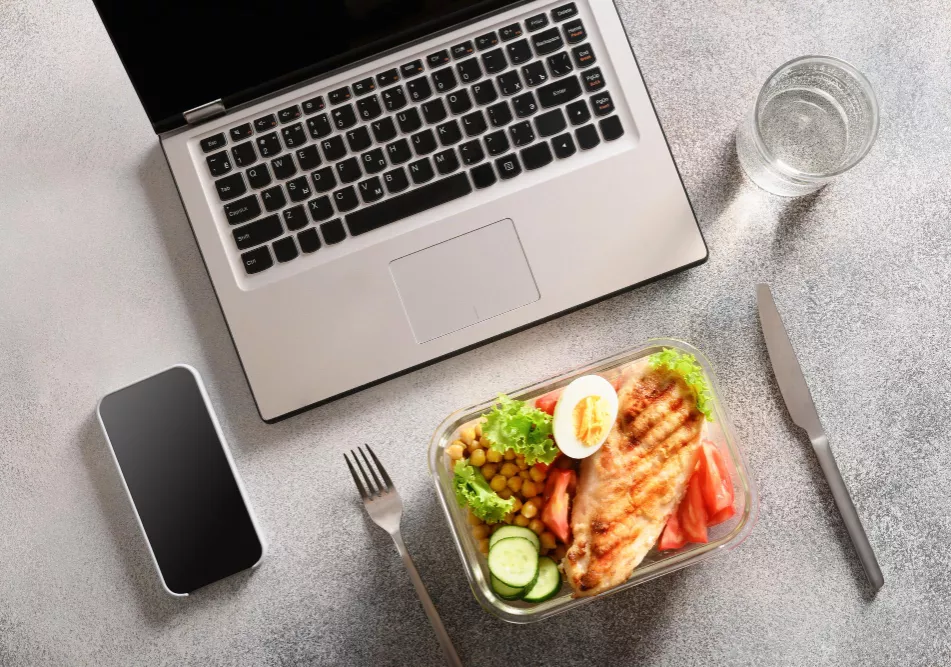 Laptop and lunch stock