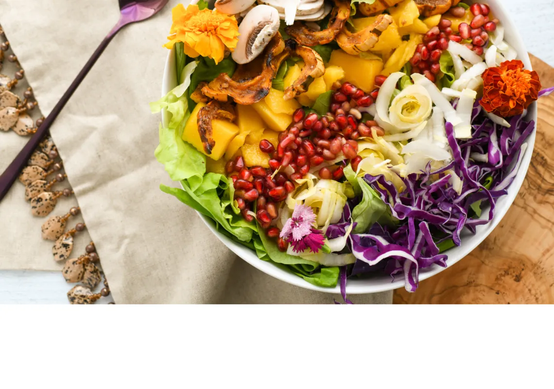 bowl of salad on a placemat with a fork