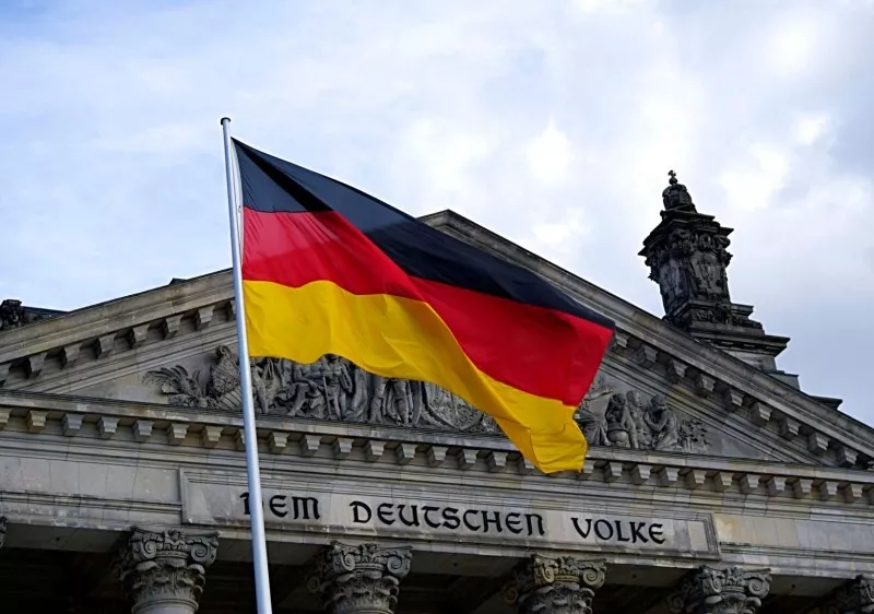 German flag infront of Dem Deutschen Volke building