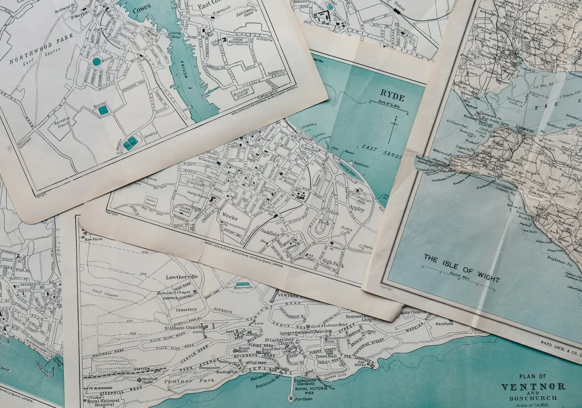 Paper maps layered on top of each other