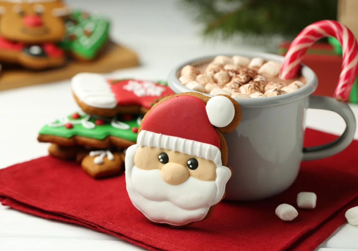 santa cookie with coffee and candy cane stock image