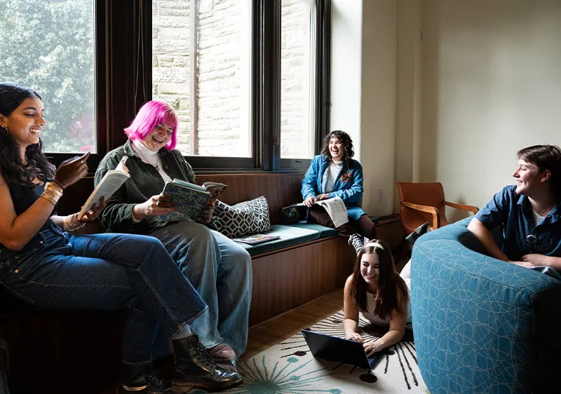 Students laughing in dorm room
