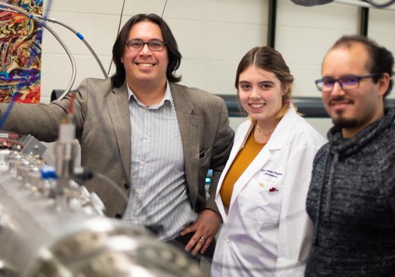 Assistant Professor of Physics David Schaffner (left), Maise Shepard '20, and Ph.D. Candidate Carlos Cartegena