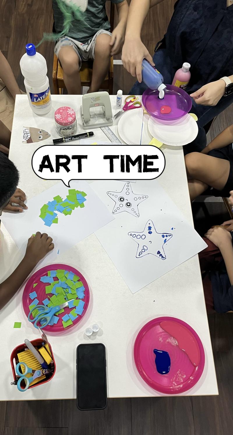 Children crafting at a desk