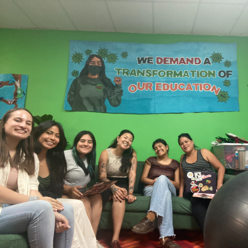 Group photo of staff sitting on a couch 