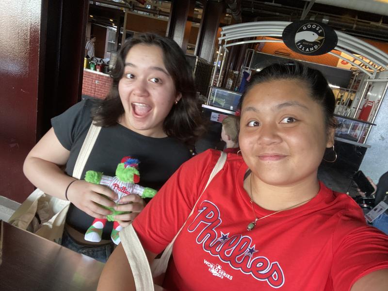 Maggie Pavao and Leilani Soriano '25 at a Phillies baseball game