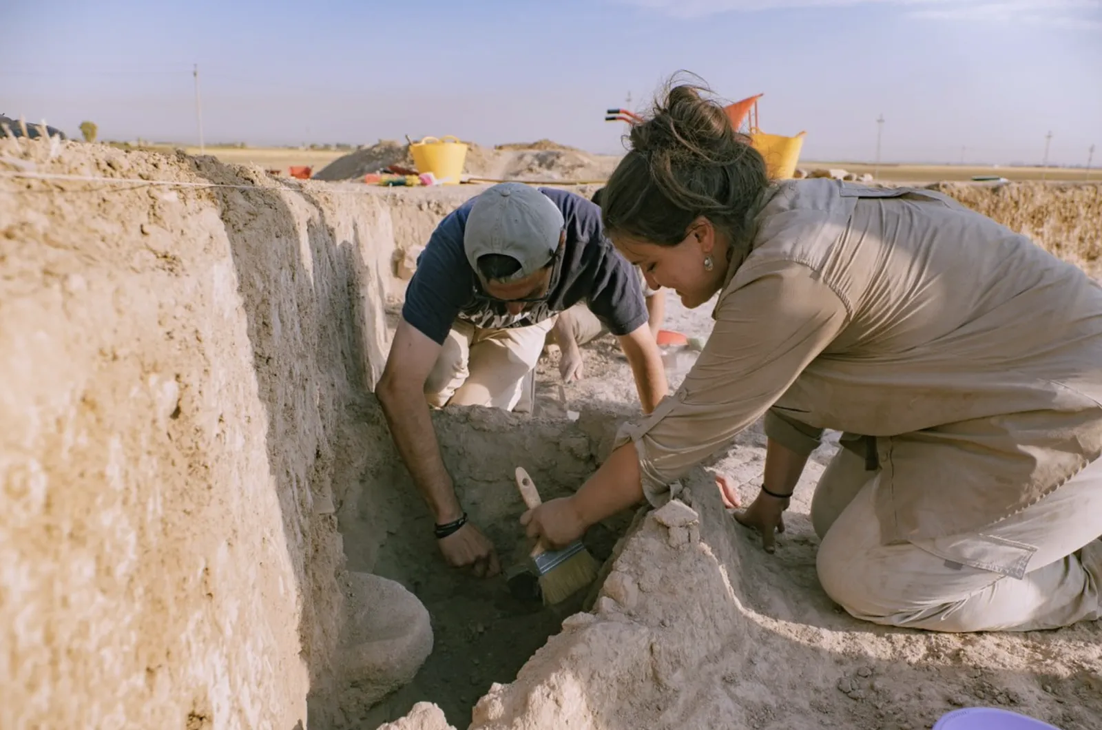 Two PhD in Archeology students posing on an excavation trip with one of the best archaeology schools in the world.