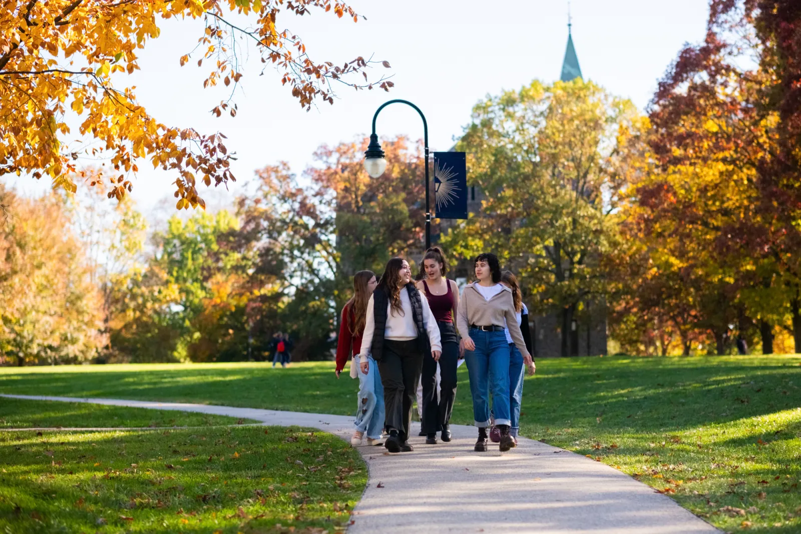 students-walking-campus-fall-free-tuition-bryn-mawr