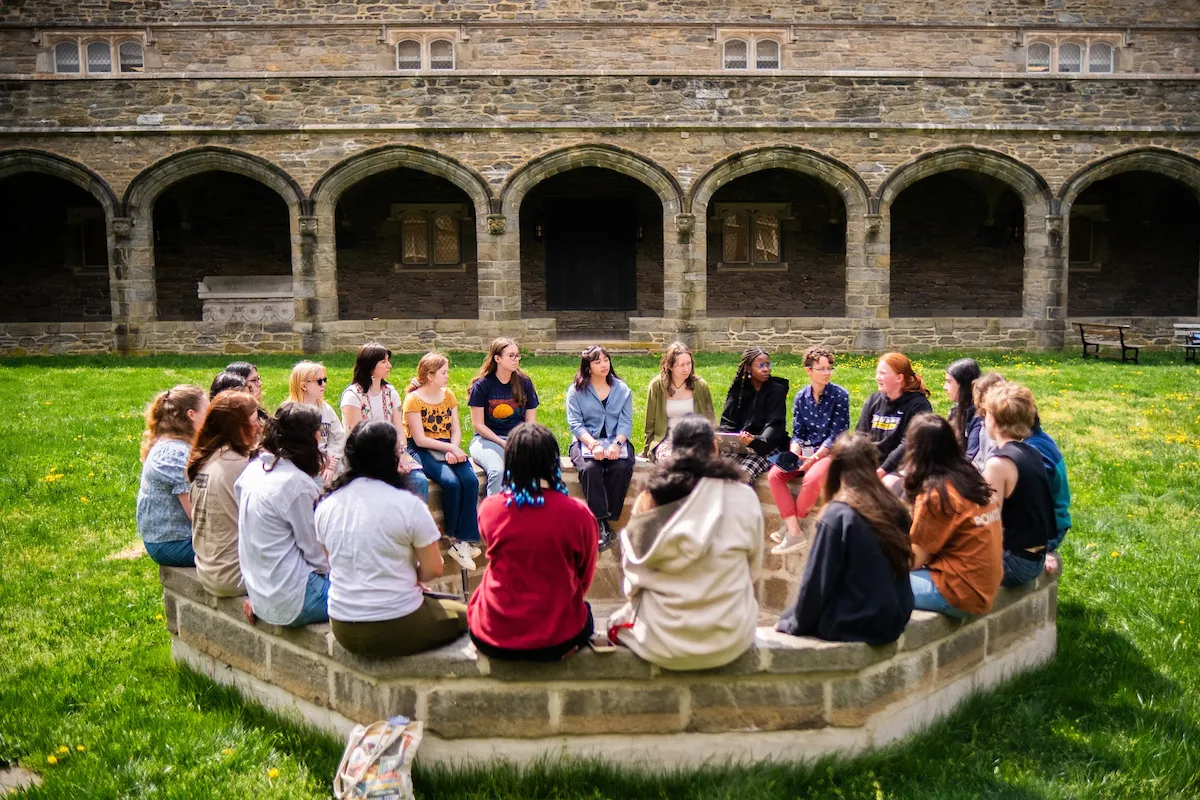 BMC students sitting in a circle outside