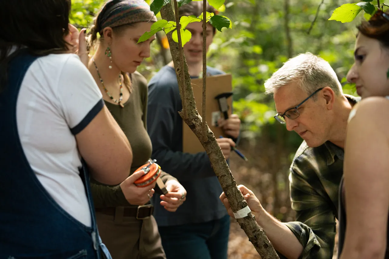 Mozdzer and students in the field