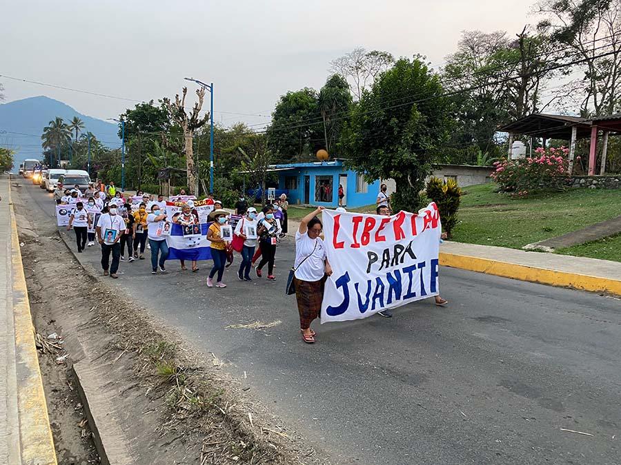 Protestors carrying signs during the Mothers March