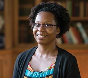 Portrait of Erica J. Graham in front of a bookshelf