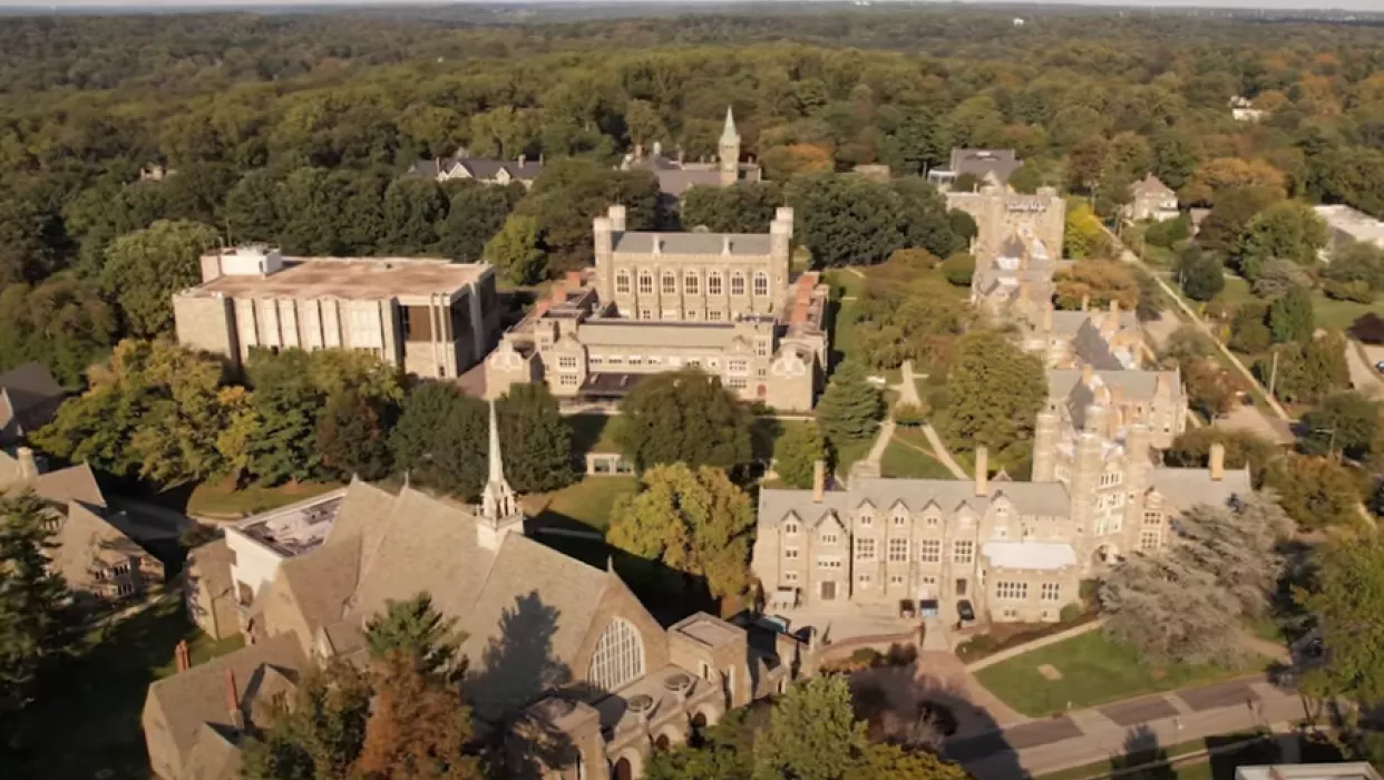 A photo of the College taken by a drone; Goodhart, Rockefeller, and Old Library feature prominently. 